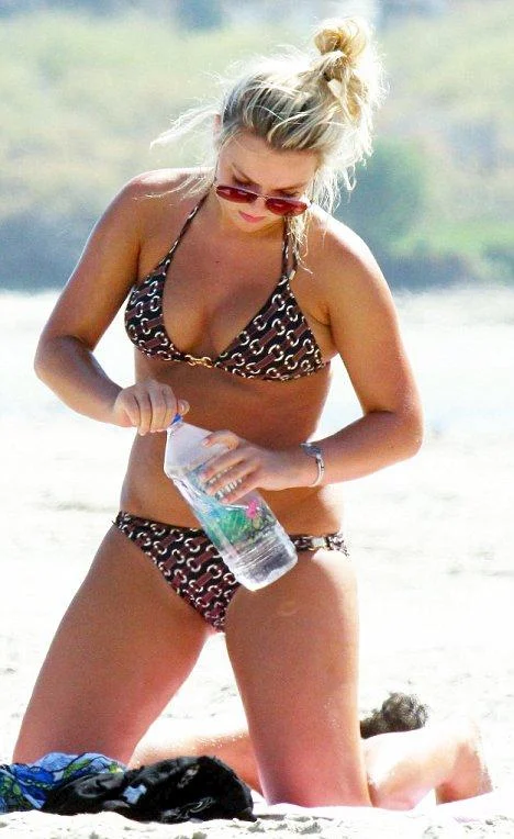 The curvy blonde girl cavorting on Malibu beach