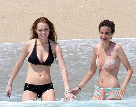 Lindsay Lohan and girlfriend Samantha frolic on the beach