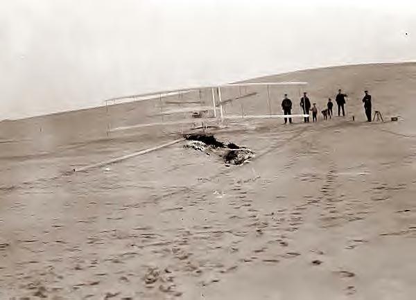 Wright Bros plane on track at Big Kill Devil Hill. 1903