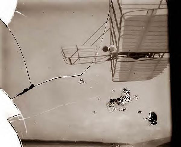 Wilbur Wright piloting plane,1901