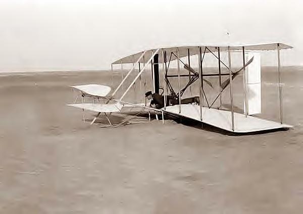 Wright, Wilbur in plane. Kitty Hawk, NC, 12-14-1903