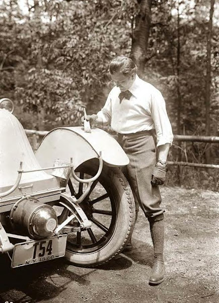 Mr. Thomas of NY painting his car. 1920