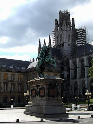 statue and St. Ouen Church