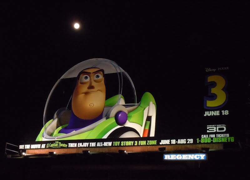 Toy Story 3 Buzz Lightyear billboard by night Toy Story 3 Buzz Lightyear billboard by night