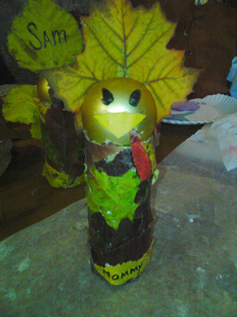Recycled Turkey toilet paper roll, old ornament, and fall leaves.