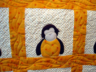 Angela added a heart to each appliqued monkey - QuiltedJoy.com