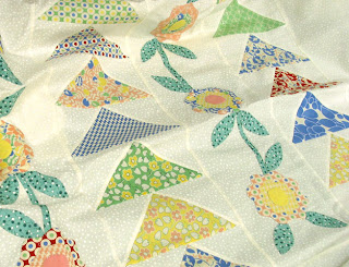Flying Geese garden quilt waiting to be quilted - QuiltedJoy.com