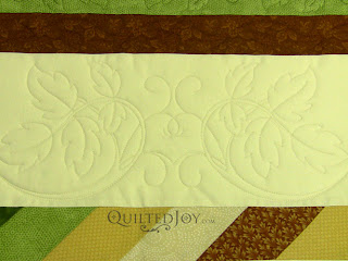 Foliage quilting theme on a Lone Star quilt - QuiltedJoy.com