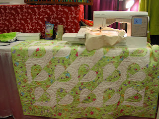 One of Angela's quilts on display at Paducah ;) - QuiltedJoy.com