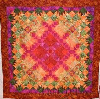 Desert Sands Batik Quilt, custom quilting by Angela Huffman - QuiltedJoy.com