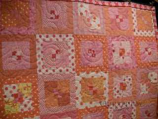 Polka Dot Party Quilt with Swirl edge to edge quilting by Angela Huffman - QuiltedJoy.com