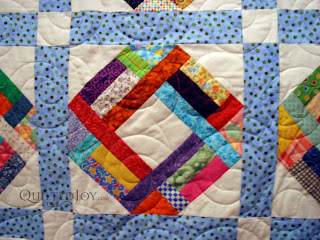 A Scrap Basket quilt with Spirals pantograph. Longarm quilting by Angela Huffman - QuiltedJoy.com