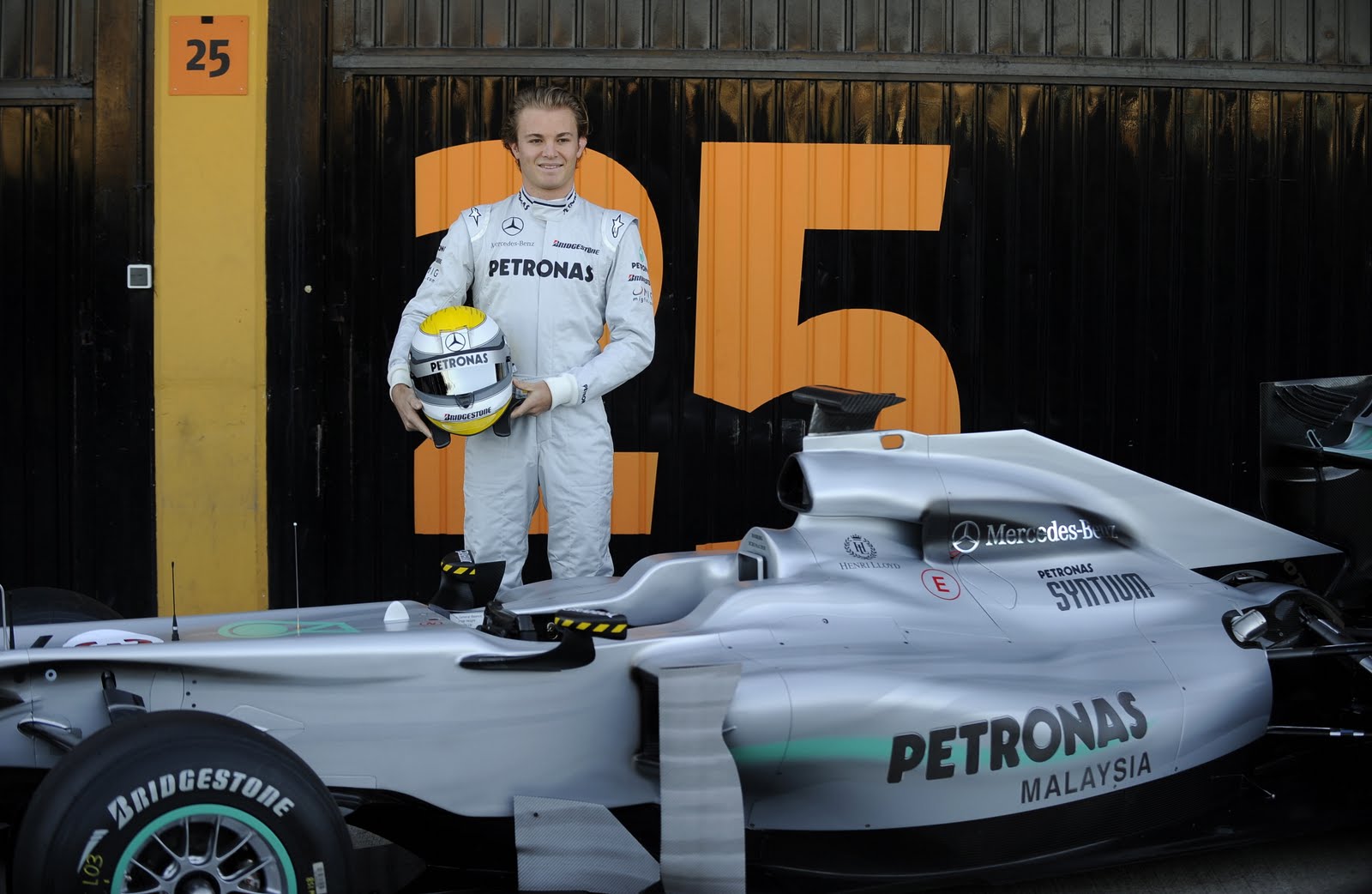 [Nico+Rosberg+(R)+poses+in+front+of+the+new+Mercedes+GP+Formula+1+car.jpg]
