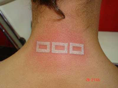 White Ink Tattoo at back of the neck