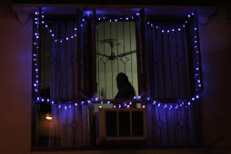 Lady in Window on Diwali
