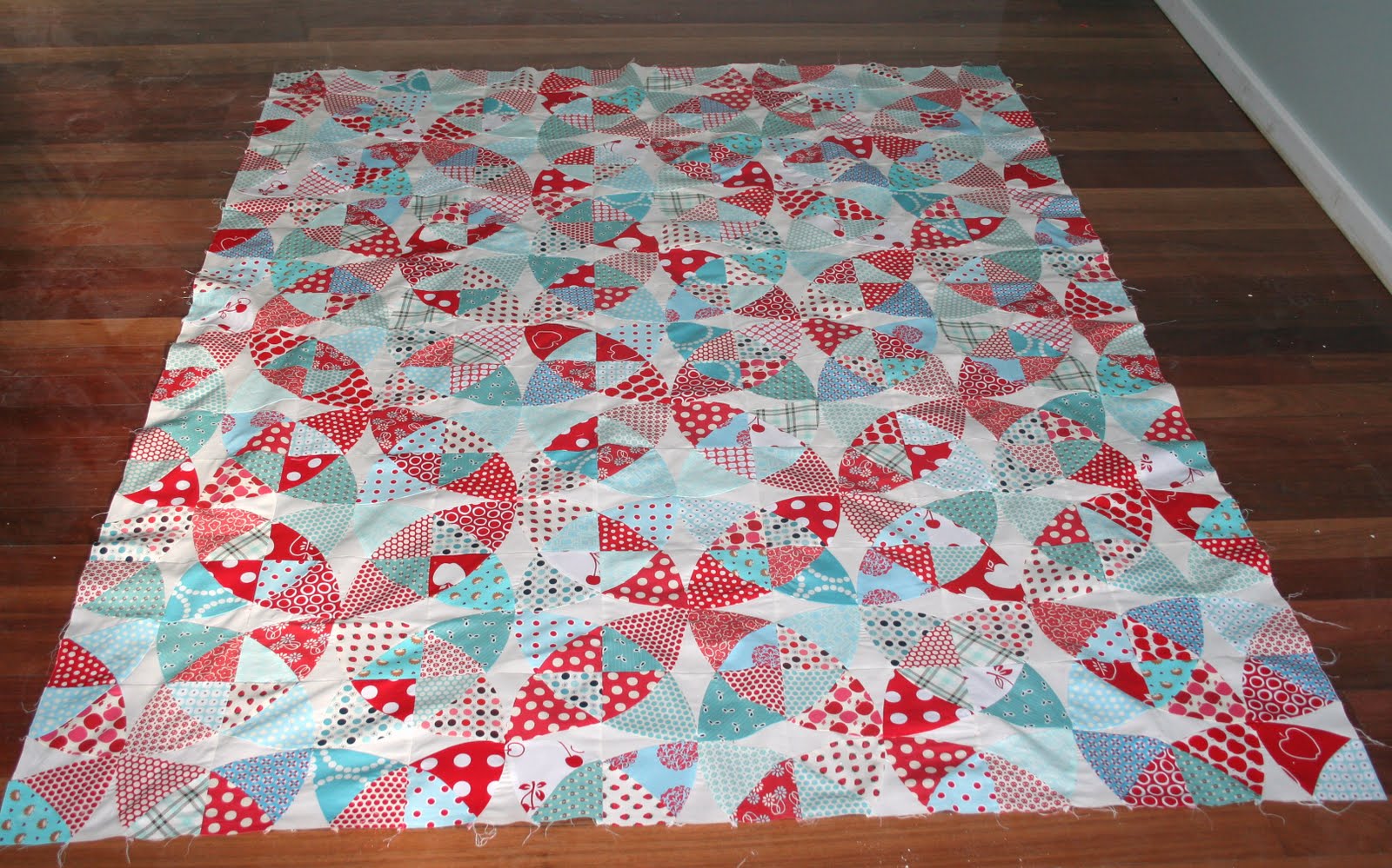 Gone Aussie Quilting Winding Ways Quilt in Aqua and Red