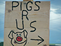 Western slang article with Pigs R Us sign 