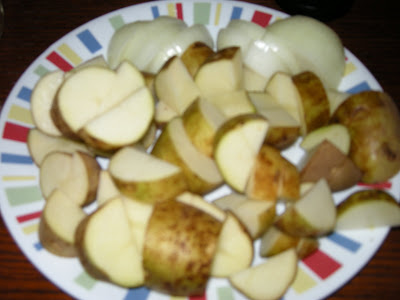 Peel and slice onion and slice potatoes.