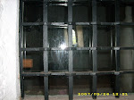 Patrishow window from cell into church