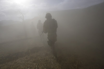 lone soldier sillouetted in heavy fog