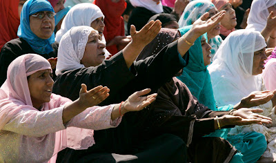 eid11 Muslim women prepare to offer prayers at the Jama Masjid mosque in New Delhi, India,