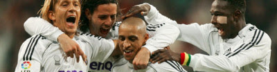 Team'mates congratulate Roberto Carlos after scoring the winner