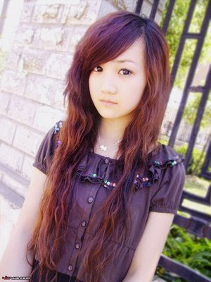 cute sweet Asian girl with straight bangs and brown hair dye