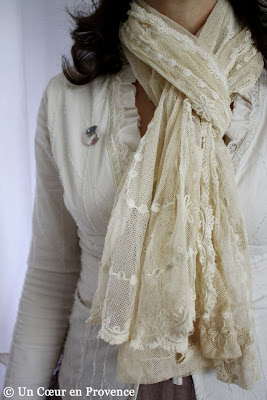 A scarf made with a piece of ecru tulle embroidered
