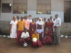 Mtoni Students Recieving Gift from Clarke Road