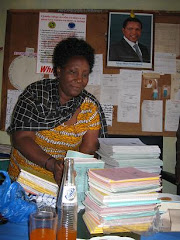 Mwalimu Hellena Buswelu with Donation