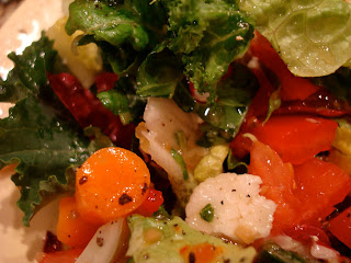 Green salad topped with Vegan Holiday-Spice Orange Vinaigrette