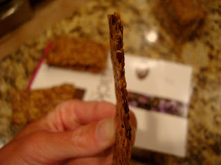 Hand showing the side of one cracker