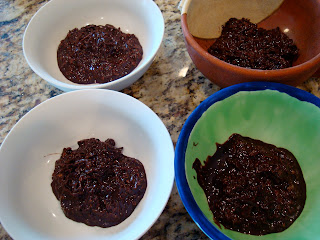 Four bowls of Raw Vegan Chocolate Coconut Snowballs
