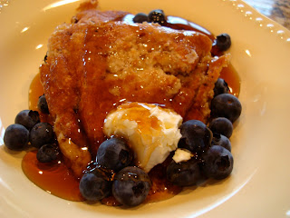 Vegan Gluten Free Pancakes on white dish with syrup, butter and blueberries 