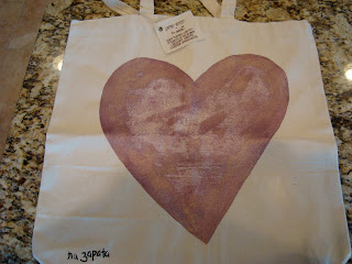 Close up of hand painted heart on bag