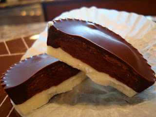 Vegan White Chocolate Chocolate-Peanut Butter Cup cut in half showing filling