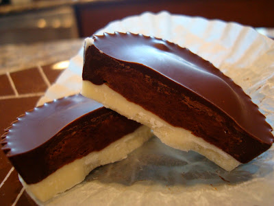 Split open Half White Chocolate/Half Dark Chocolate Outer Coating with Chocolate PB Center stacked
