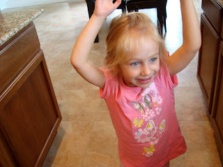Little girl dancing in kitchen