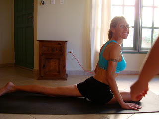 Woman doing Eka Pada Rajakapotasana yoga pose