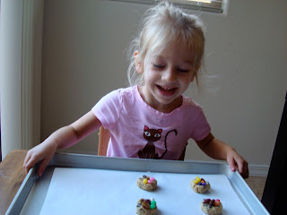Young girl holding tray of cookies