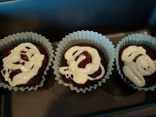 Three PB Cup Brownie Cupcakes in paper liners