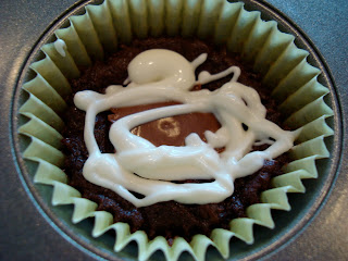Peanut Butter Cup Brownie Cupcake with white chocolate icing