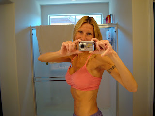 Side view of woman in pink sports bra