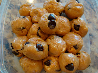 Overhead of No-Bake Vegan Peanut Butter Chocolate Chip Cookie Dough Balls in clear container