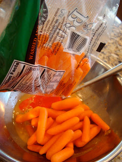 Baby carrots being poured into mixture 