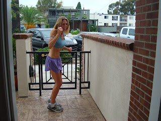 Woman outside in running gear getting ready for a run