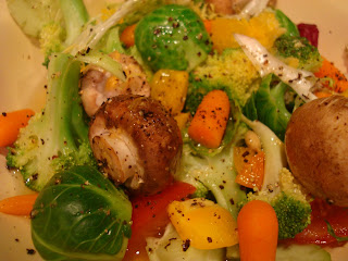 Mixed raw vegetables in white bowl seasoning