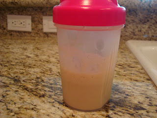 Vanilla protein powder and water mixed in blender bottle