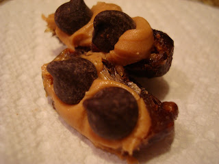 Ant's on a log made from dates, peanut butter and dark chocolate chips