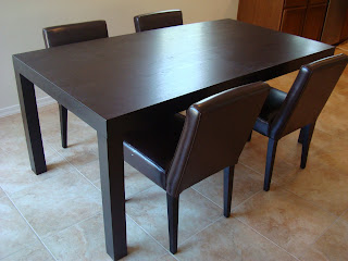 West Elm Chocolate colored table with four chairs